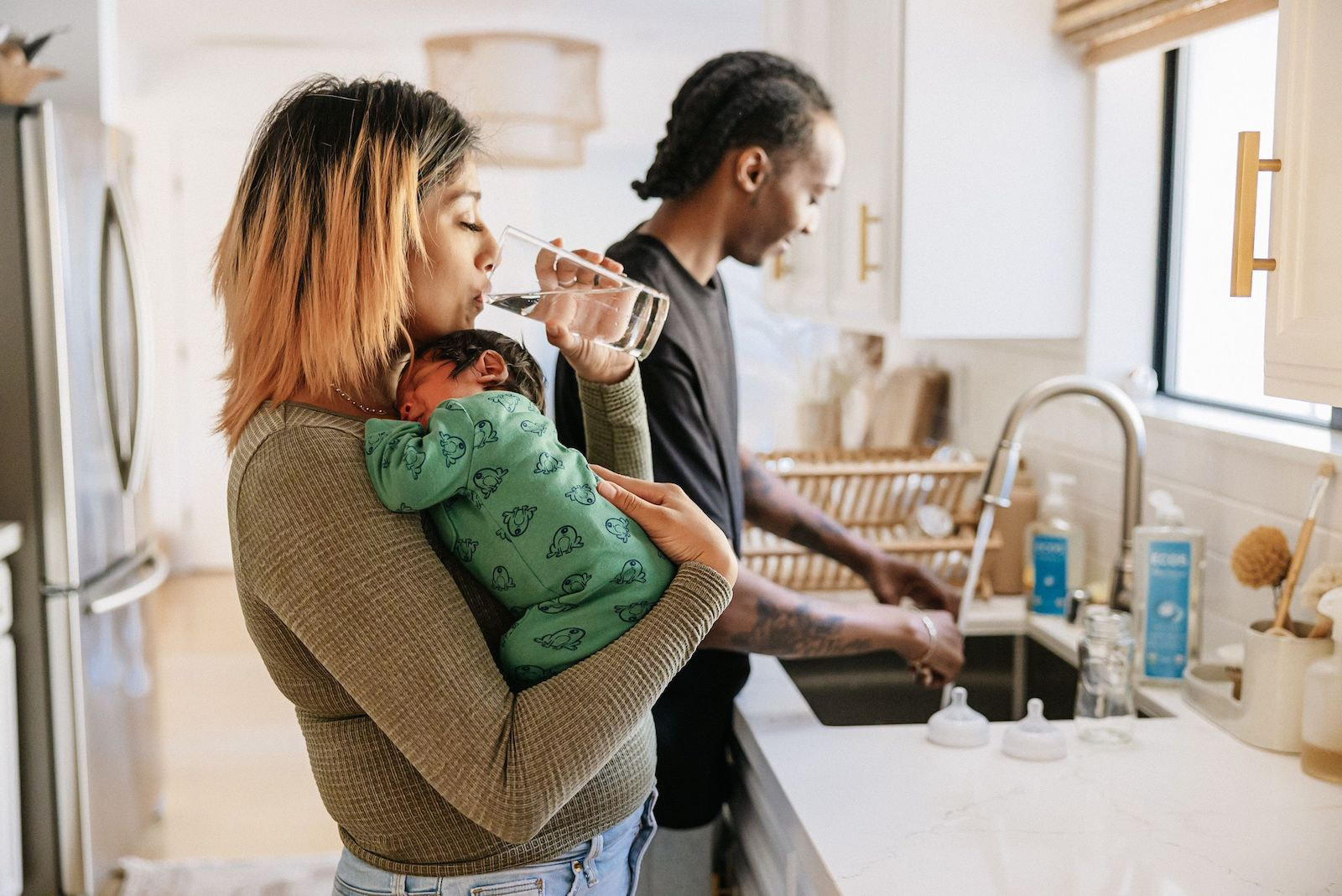 Couple in Kitchen with Newborn