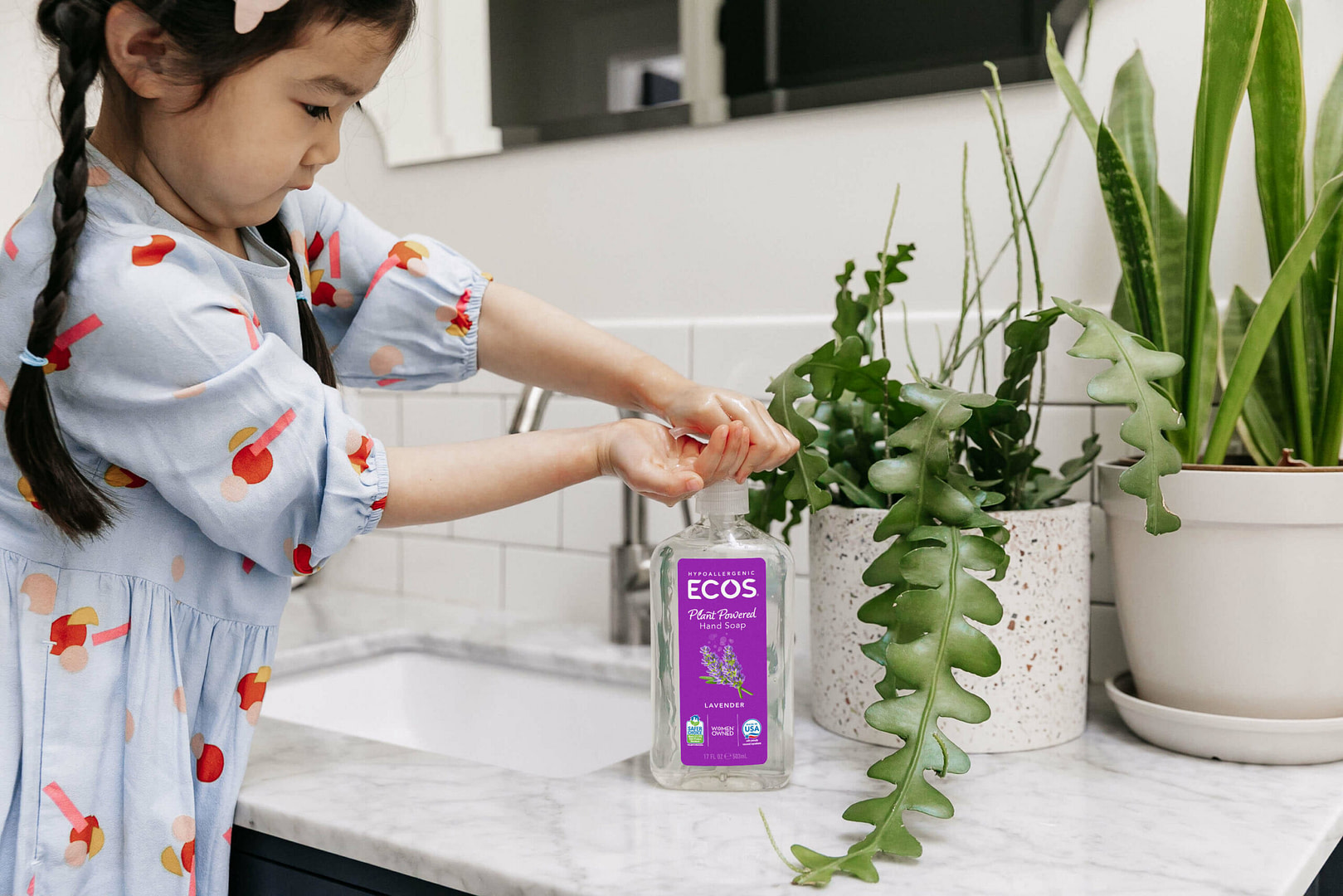 Child using ECOS hand soap