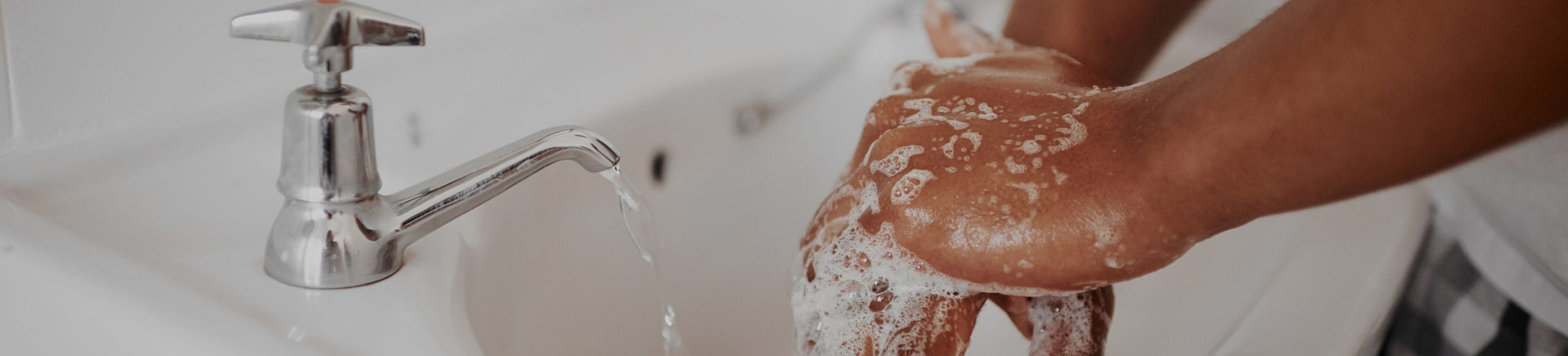 Person Washing Hands With Hypoallergenic Hand Soap