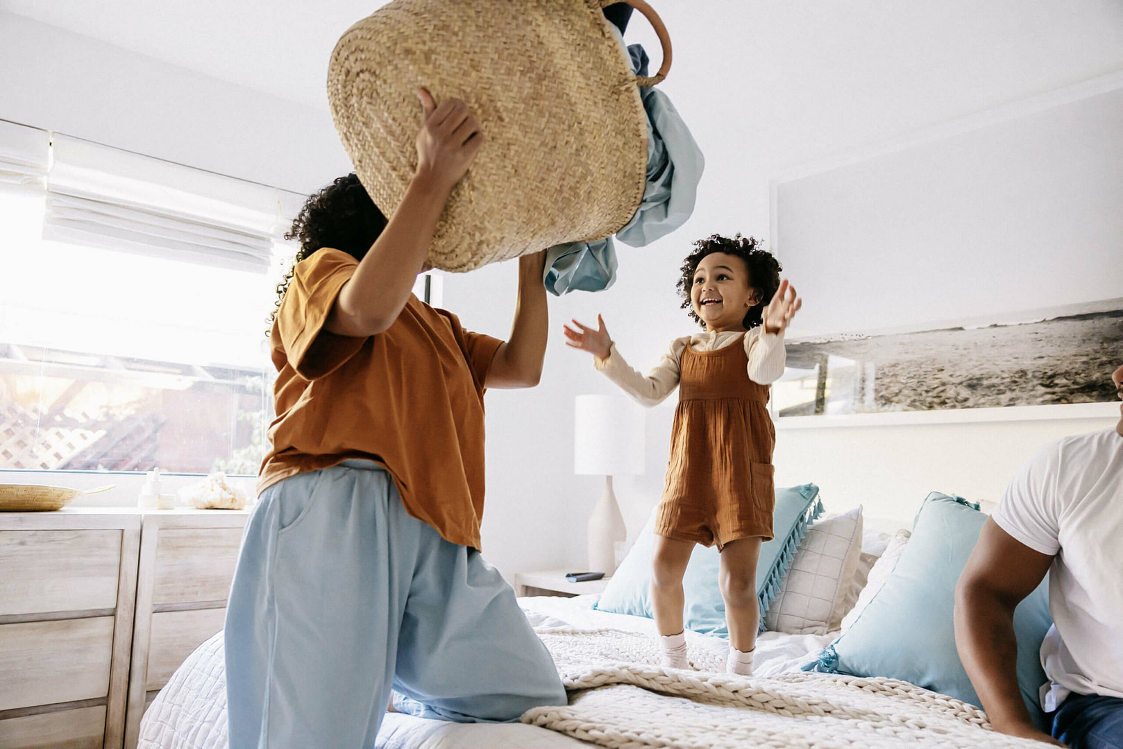Mother and Daughter Laundry on Bed