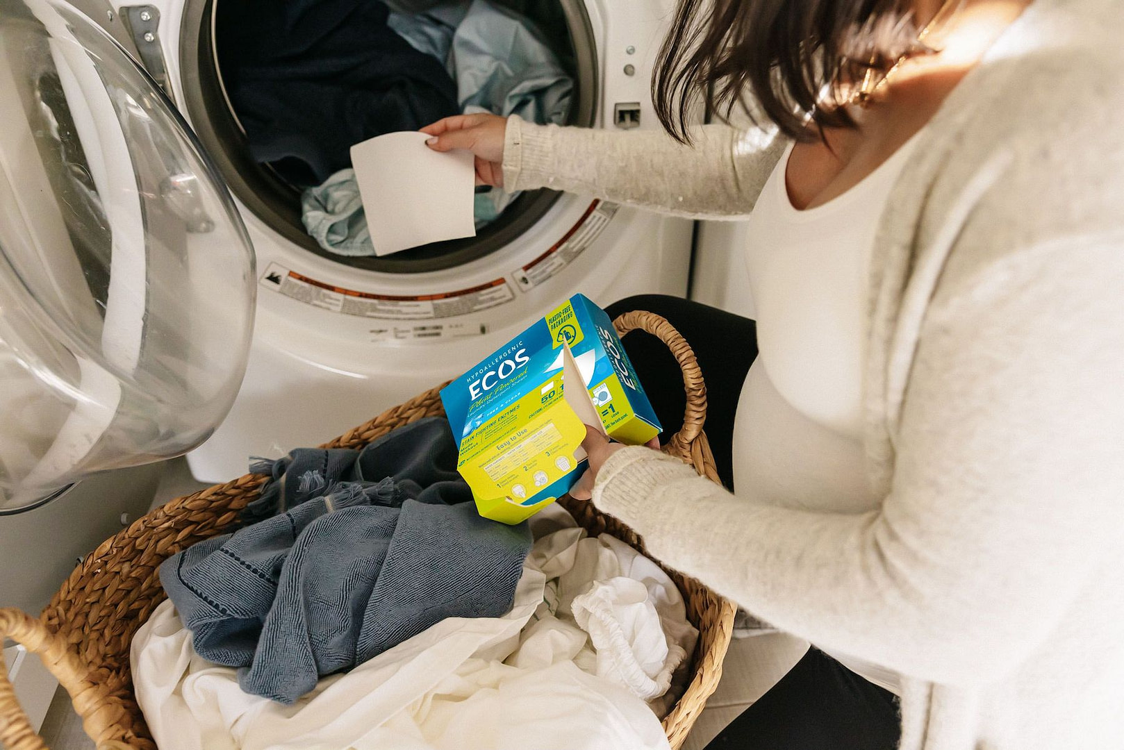 Woman Using ECOS Laundry Sheets